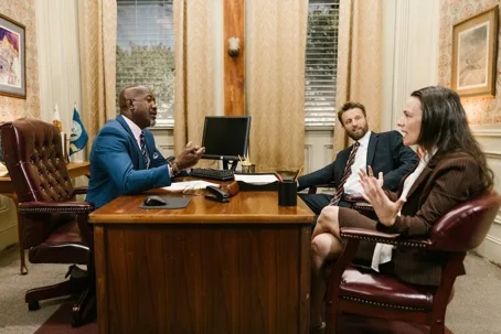 Lawyer meeting with two clients