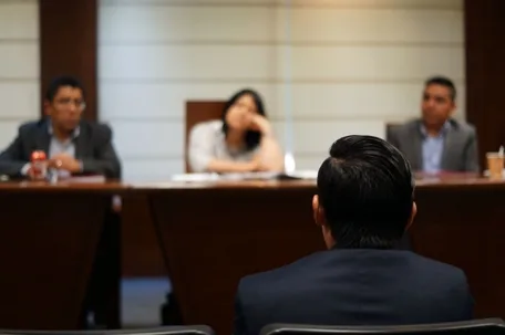 Applicant facing a job interview or legal panel discussion