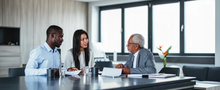 Couple meeting with attorney in office