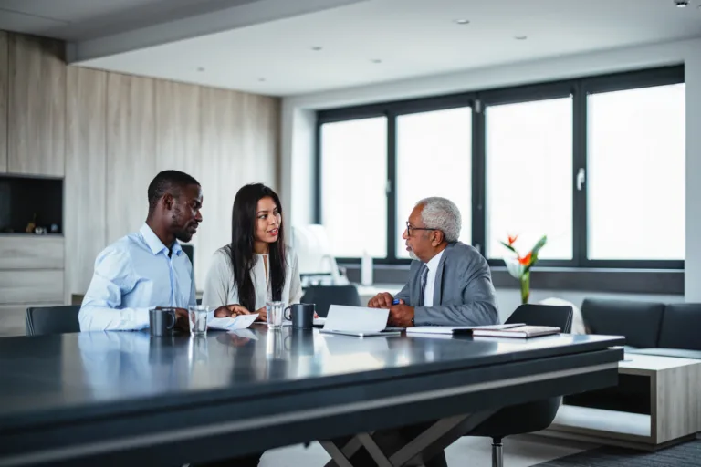 Couple meeting with attorney in office
